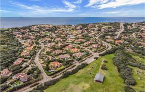 an aerial view of a suburb with the ocean at Villa 4 in Stintino +11 photos