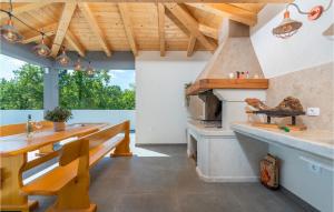 a kitchen with a stove and a wooden bench at Villa Casa Mara in Pula +40 photos