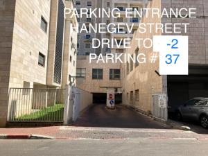 a parking entrancenance emergency street drive to parking at SUCASA RA’ANANA in Ra‘ananna