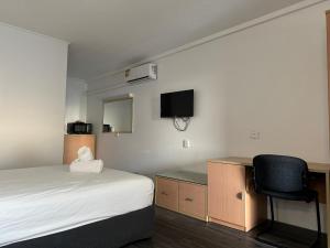 Postel nebo postele na pokoji v ubytování Annerley Motor Inn + 37 fotografií
