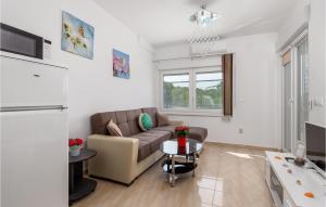 a living room with a couch and a table at 1 Bedroom Awesome Apartment In Vrh in Vrh