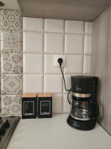 a coffee maker on a counter in a kitchen at Central Luxury Apartment in Rethymno Town +7 photos
