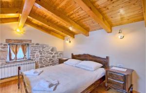 a bedroom with a bed and a stone wall at Villa Stancija Bursic in Pula +33 photos