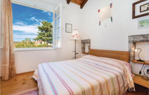 Posteľ alebo postele v izbe v ubytovaní Beautiful Apartment In Barbat