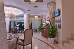 TV a/nebo společenská místnost v ubytování Swiss Inn Nile Hotel