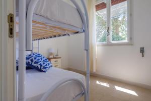 Postel nebo postele na pokoji v ubytování Villa a Punta Prosciutto + 18 fotografií