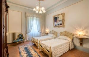 Łóżko lub łóżka w pokoju w obiekcie Villa Pieve, Lucignano