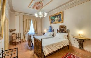 Łóżko lub łóżka w pokoju w obiekcie Villa Pieve, Lucignano