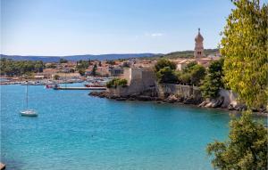 a river with a small boat in the water at 3 Bedroom Gorgeous Apartment In Krk in Krk +47 photos