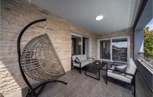 a porch with a hammock on a house at Villa Bibinje in Bibinje