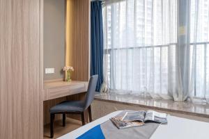Ένα ή περισσότερα κρεβάτια σε δωμάτιο στο Hantao AI Select International Apartment