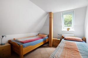 Katil atau katil-katil dalam bilik di Ferienwohnung H H Ingwersen