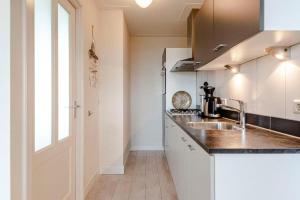 Kuchyň nebo kuchyňský kout v ubytování Appartement De Kokkel Free Parking + 20 fotografií