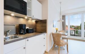 Kuchyň nebo kuchyňský kout v ubytování Baltischer Hof Apartment 58