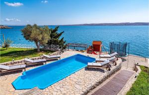 a swimming pool with a view of the water at Villa Tiffany in Zadar