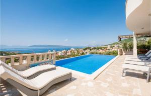 a villa with a swimming pool and a view at Amazing Home In Makarska in Makarska