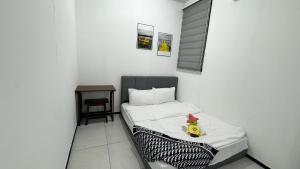 a small bedroom with a bed with a rubber duck on it at 22 Urban Suites #Georgetown #NEW #TopFacilities in Jelutong