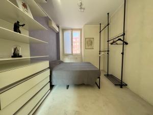 Postel nebo postele na pokoji v ubytování La casa di Wayne