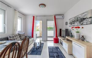 a living room with a couch and a table at Stunning Apartment In Krusevo With Wifi in Kruševo