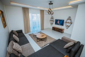a living room with a couch and a table at One Suit in Kartepe