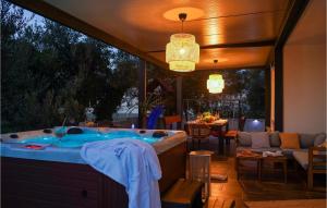 a jacuzzi tub in a room with a patio at Villa Suncica in Sukošan