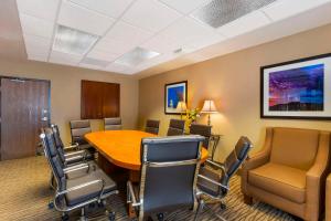 a conference room with a wooden table and chairs at Comfort Inn Green Valley I-19 in Green Valley +55 photos