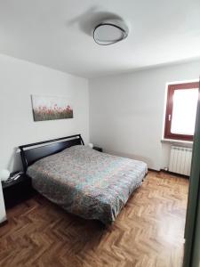 Postel nebo postele na pokoji v ubytování Appartamento Cogno
