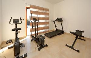 a gym with several exercise bikes in a room at Awesome Home In Starigrad Paklenica in Starigrad-Paklenica