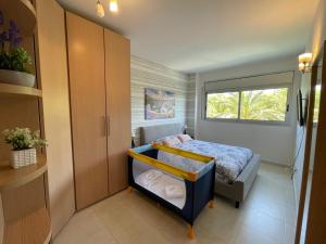 A bed or beds in a room at Alquiler Vacacional Salou W&S
