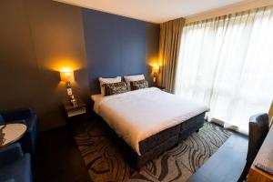 Postel nebo postele na pokoji v ubytování City Hotel Gouda, WorldHotels Crafted Collection