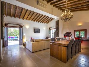 a living room with a couch and a table at Farmhouse in Ibiza with Bali Pavilion in Santa Gertrudis de Fruitera