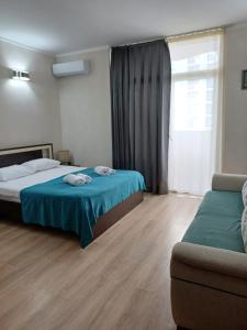 Postel nebo postele na pokoji v ubytování Orbi Sea Towers Batumi on Khimshiashvili 15 + 35 fotografií