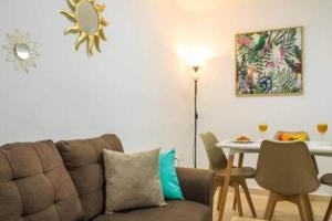 a living room with a couch and a table at Apartamento Luna in Tías