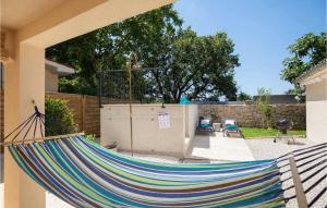 a hammock in the backyard of a house at Villa Giorgio Jursici in Svetvinčenat