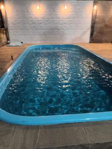 Bazén v ubytování Casa para Veraneio em Torres nebo v jeho okolí + 9 fotografií