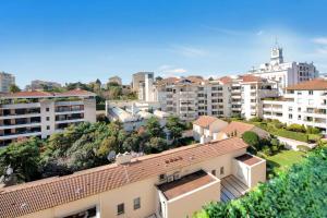 a view of a city with buildings and trees at The Jungle - Jacuzzi, Sauna & Projector in Cannes