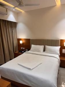 Postel nebo postele na pokoji v ubytování Hotel Neem Heritage