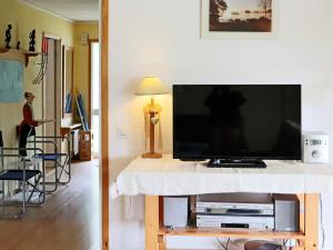 a flat screen tv on a table in a living room at 4 star holiday home in Unnaryd in Unnaryd