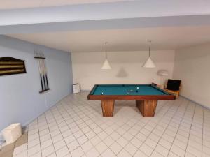 a room with a pool table in it at 4 star holiday home in Kalvehave in Kalvehave