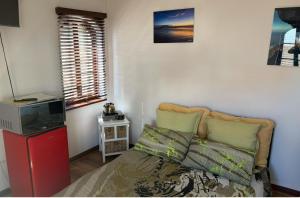 Ένα ή περισσότερα κρεβάτια σε δωμάτιο στο Aderem Blus Rooms