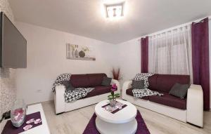 a living room with two couches and a table at Villa Vittorio in Rovinj