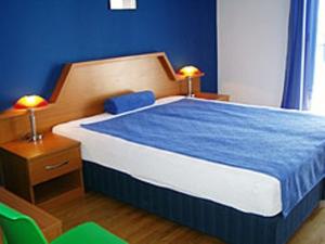 Postel nebo postele na pokoji v ubytování Villa Rosa