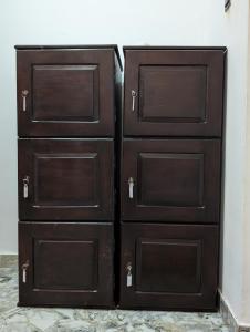 a pair of wooden drawers in a room at Costels Mirissa in Mirissa