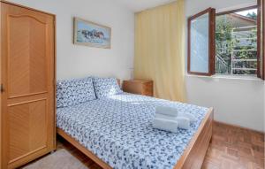 Posteľ alebo postele v izbe v ubytovaní Beautiful Apartment In Novi Vinodolski