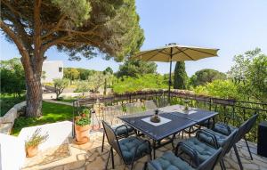 a patio with a table and chairs and an umbrella at Casa Bizzarra in Rovinj +42 photos