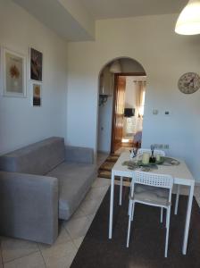 a living room with a couch and a table at Mountain Serenity junior in Konitsa
