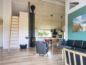 a living room with a couch and a table at 4 star holiday home in Sydals-By Traum in Neder Lysabild