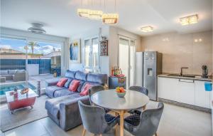 a living room with a couch and a table at Lovely Home In Cartagena With Kitchen in Cartagena