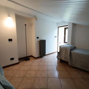 Postel nebo postele na pokoji v ubytování Cascina Flino