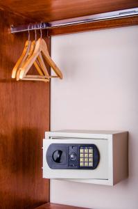 a kitchen with a tv and a microwave at Alwa Hotel Boutique Premium in Arequipa